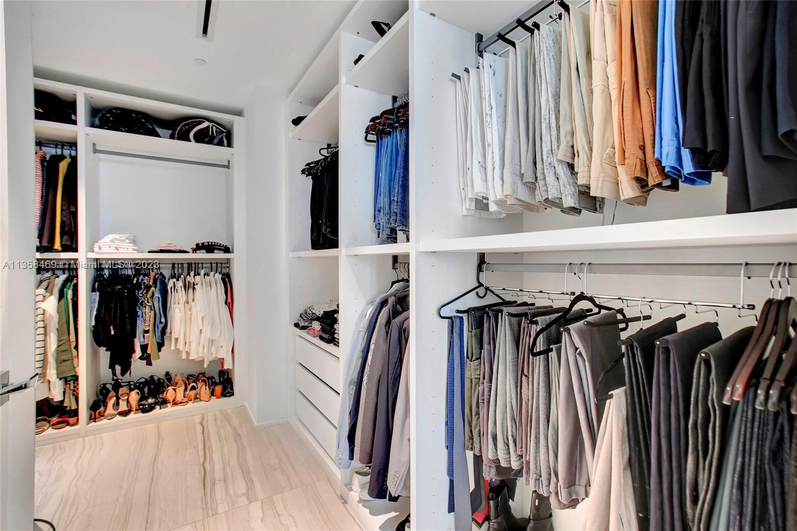 1000 Biscayne Boulevard, Unit 2802 Miami, FL 33132 - Photo 24 of 38 a view of walk in closet with clothes and shoes