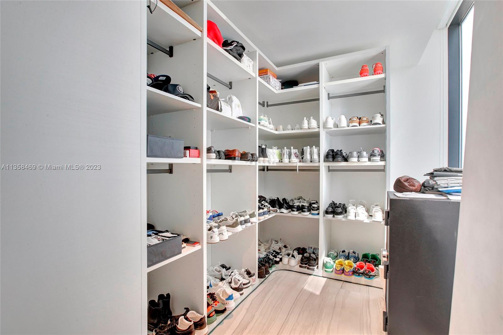 1000 Biscayne Boulevard, Unit 2802 Miami, FL 33132 - Photo 25 of 38 a room with furniture and clutter