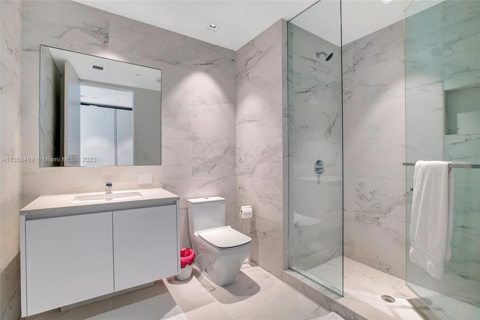 1000 Biscayne Boulevard, Unit 2802 Miami, FL 33132 - Photo 26 of 38 a bathroom with a sink toilet and shower