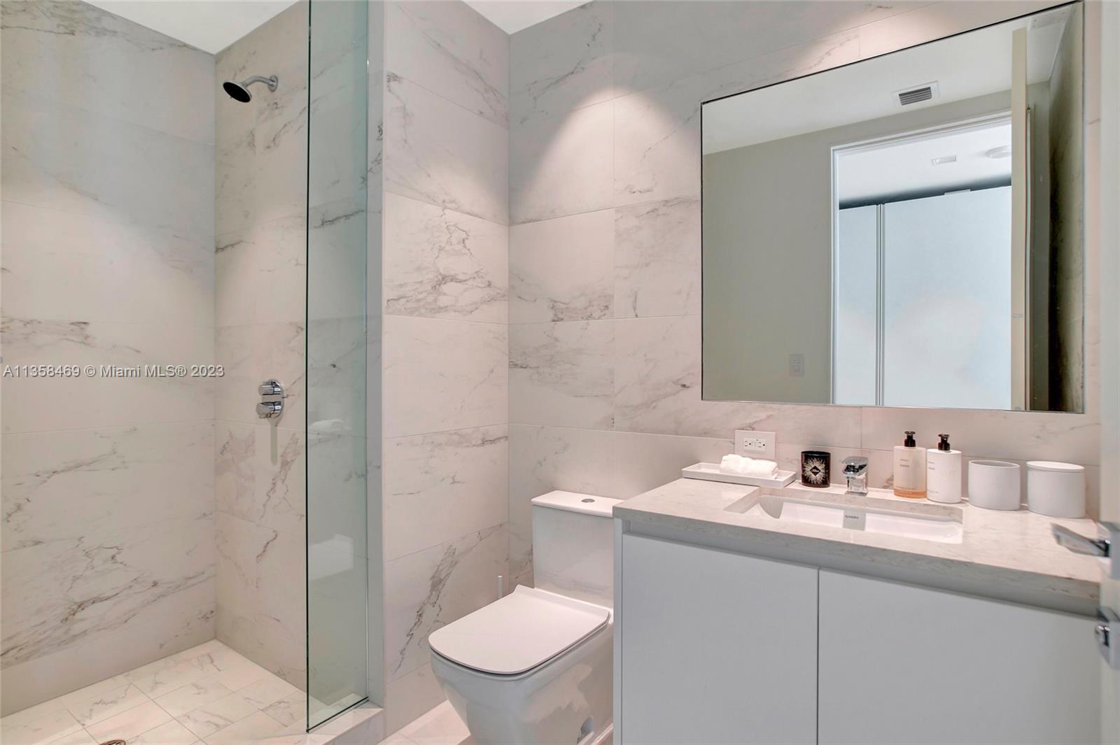 1000 Biscayne Boulevard, Unit 2802 Miami, FL 33132 - Photo 28 of 38 a bathroom with a sink toilet and shower