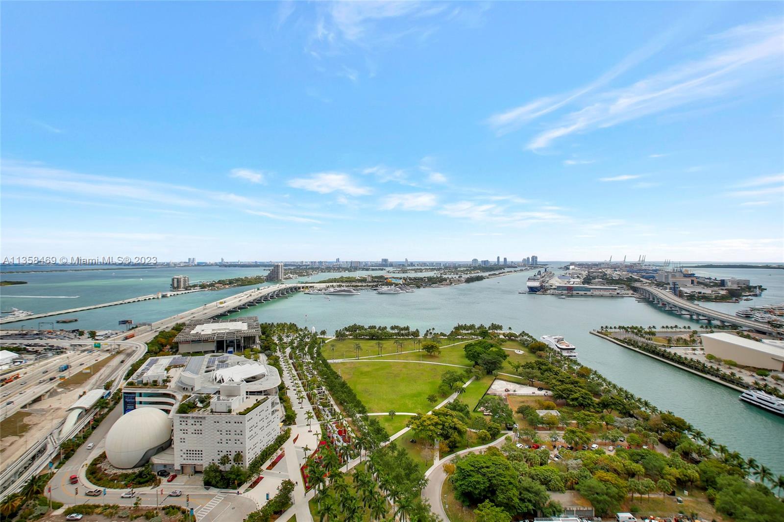 1000 Biscayne Boulevard, Unit 2802 Miami, FL 33132 - Photo 35 of 38 a view of a lake with a table and chairs