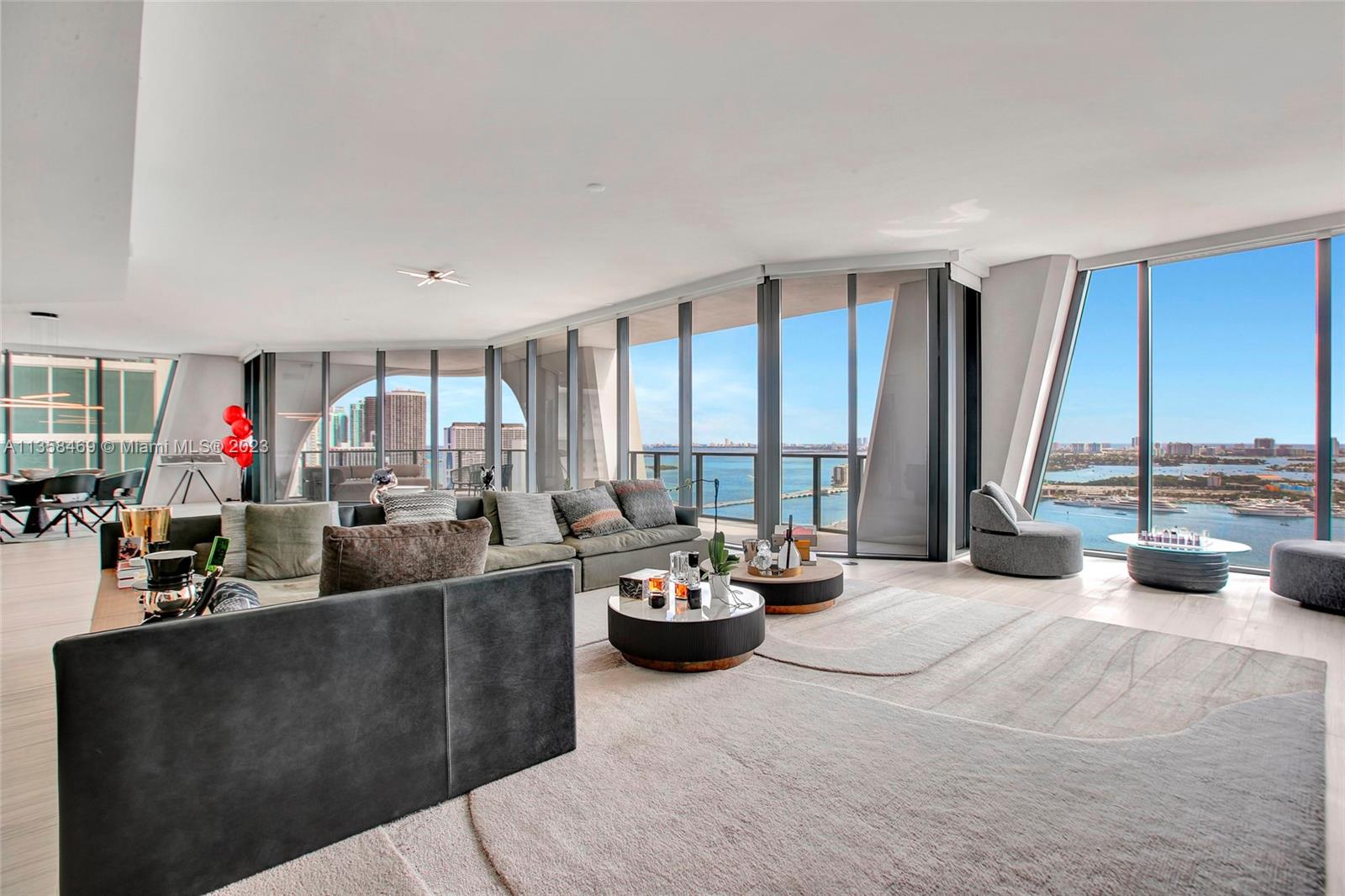 1000 Biscayne Boulevard, Unit 2802 Miami, FL 33132 - Photo 4 of 38 a living room with furniture and large windows