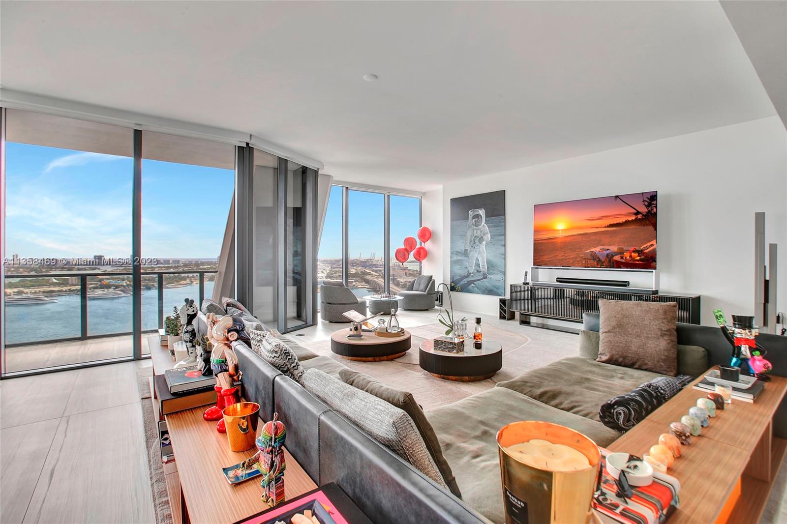 1000 Biscayne Boulevard, Unit 2802 Miami, FL 33132 - Photo 5 of 38 a living room with furniture and a flat screen tv