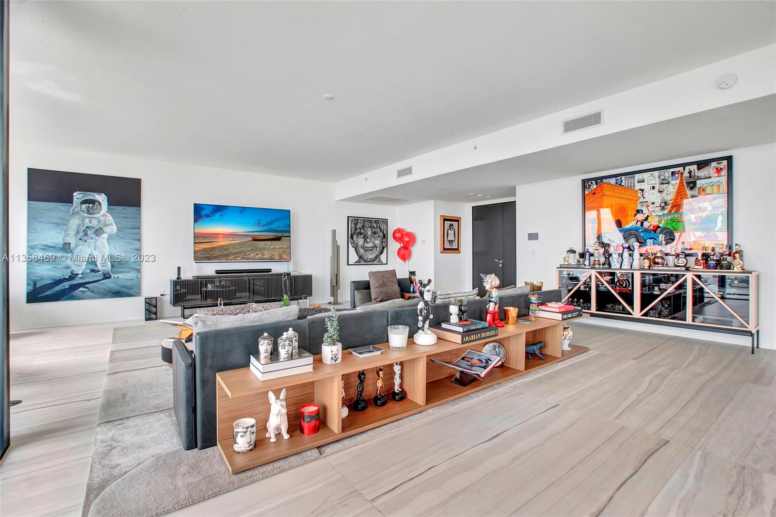 1000 Biscayne Boulevard, Unit 2802 Miami, FL 33132 - Photo 6 of 38 a living room with furniture and a flat screen tv