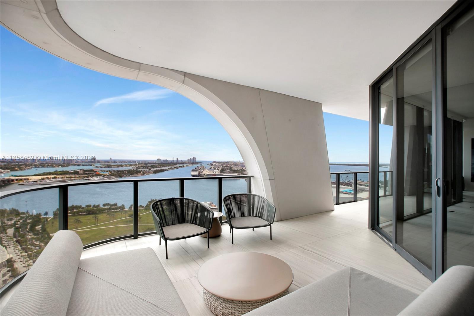 1000 Biscayne Boulevard, Unit 2802 Miami, FL 33132 - Photo 8 of 38 a living room with furniture and a floor to ceiling window