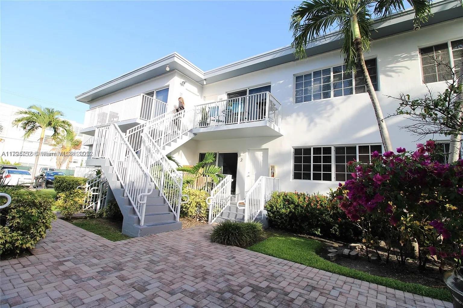 9260 Bay Harbor Terrace, Unit 22 Bay Harbor Islands, FL 33154 - Photo 21 of 24 a front view of a house with garden