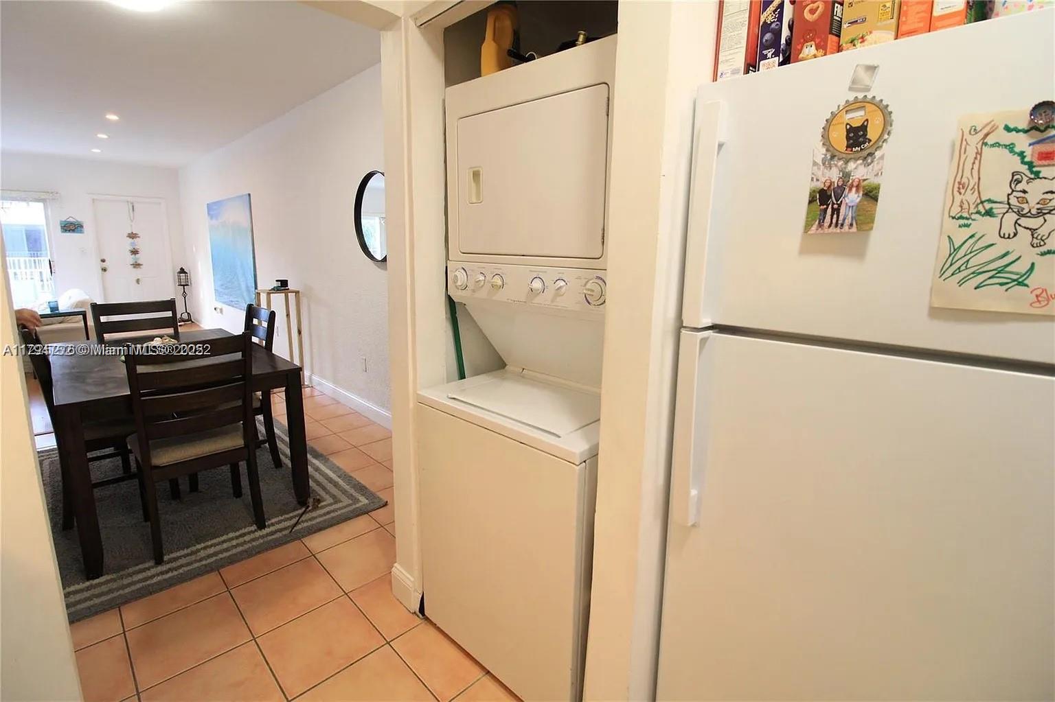 9260 Bay Harbor Terrace, Unit 22 Bay Harbor Islands, FL 33154 - Photo 5 of 24 a utility room with dryer and washer