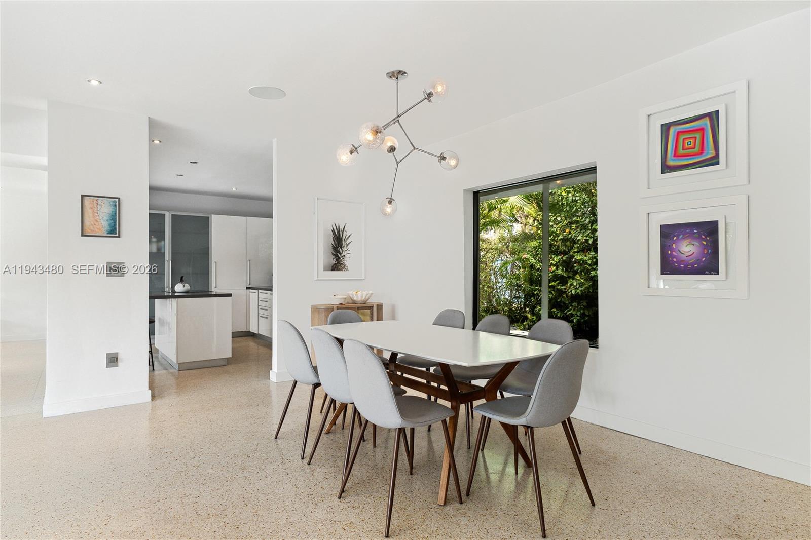 12901 Oleander Road North Miami, FL 33181 - Photo 14 of 30 a view of a dining room with furniture and a chandelier