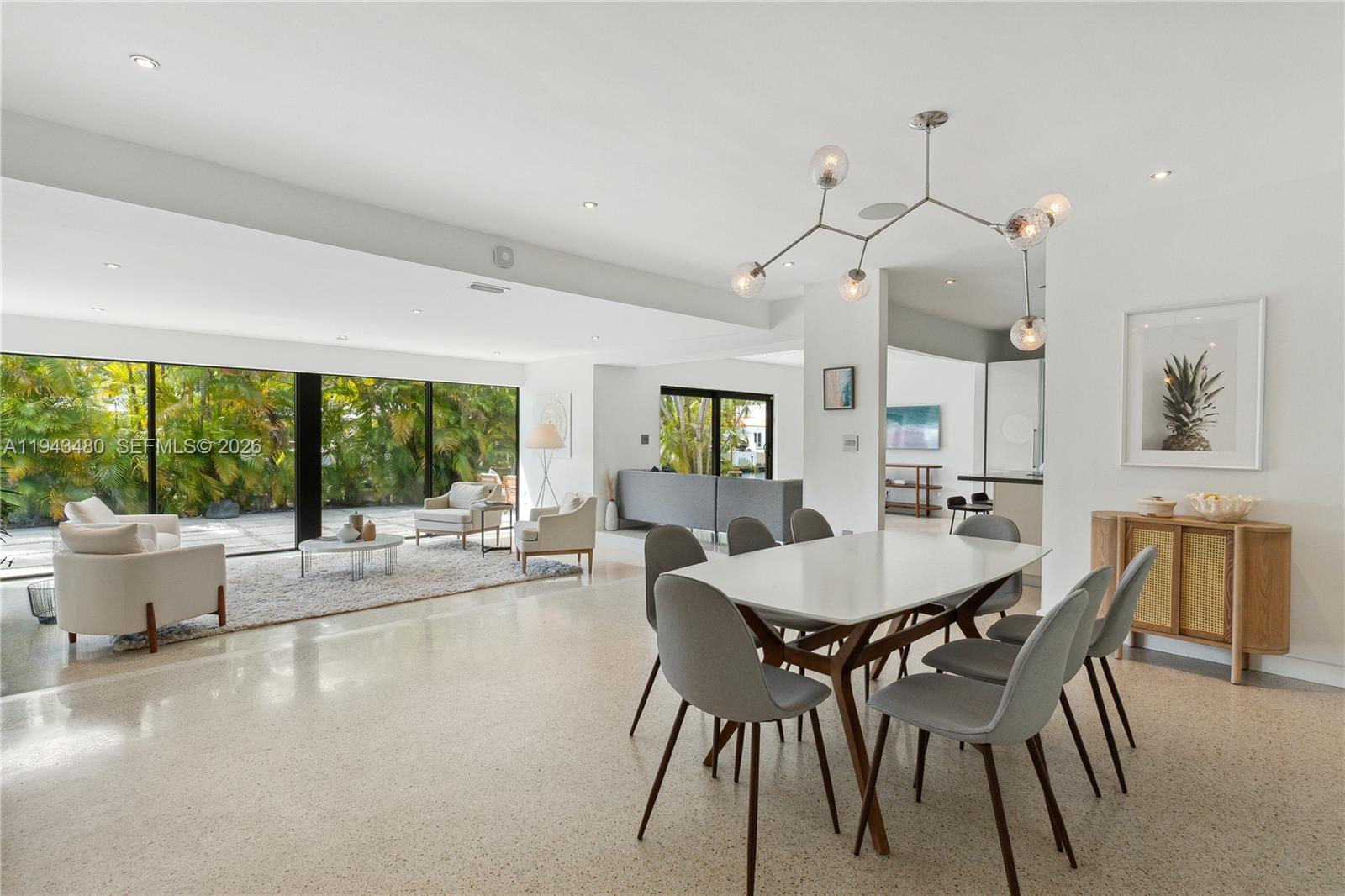 12901 Oleander Road North Miami, FL 33181 - Photo 15 of 30 a dining room with furniture window and wooden floor