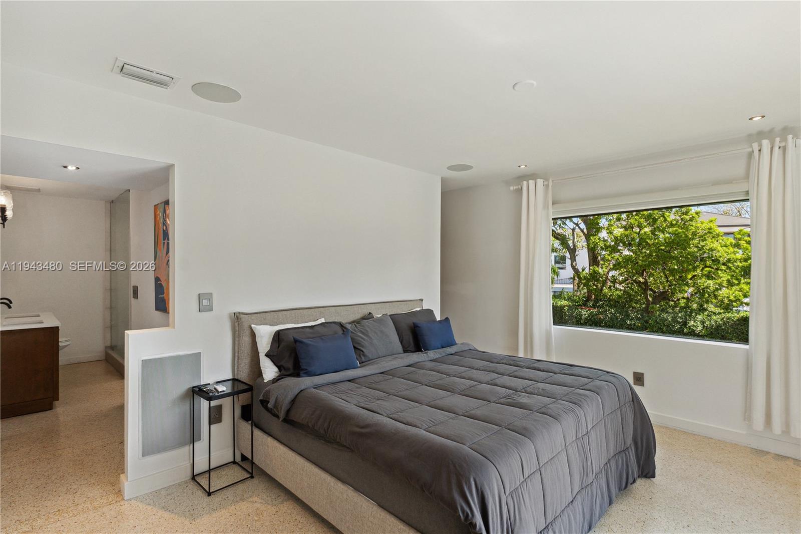 12901 Oleander Road North Miami, FL 33181 - Photo 17 of 30 a bedroom with a bed and a window