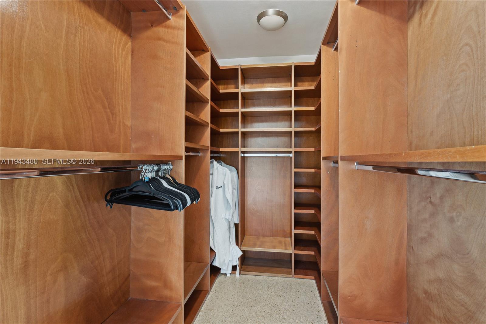 12901 Oleander Road North Miami, FL 33181 - Photo 18 of 30 a view of walk in closet with empty racks