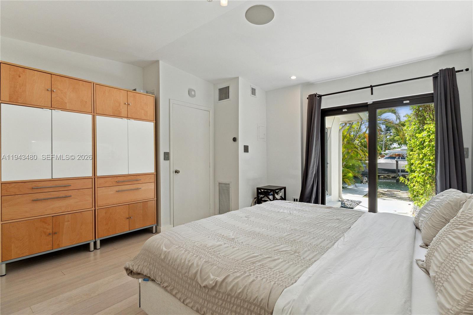 12901 Oleander Road North Miami, FL 33181 - Photo 20 of 30 a bedroom with a bed and a large window