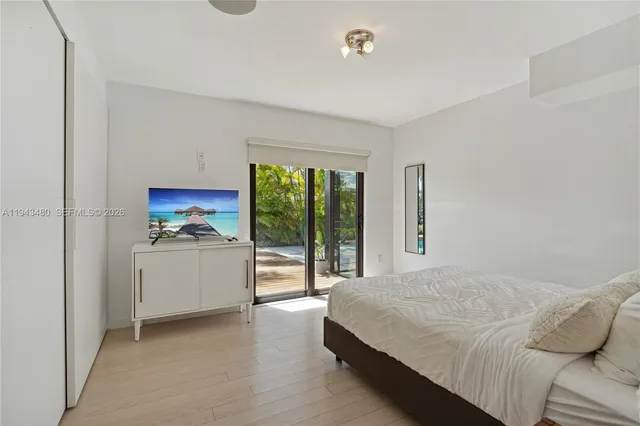 a bathroom with a sink toilet a mirror and shower
