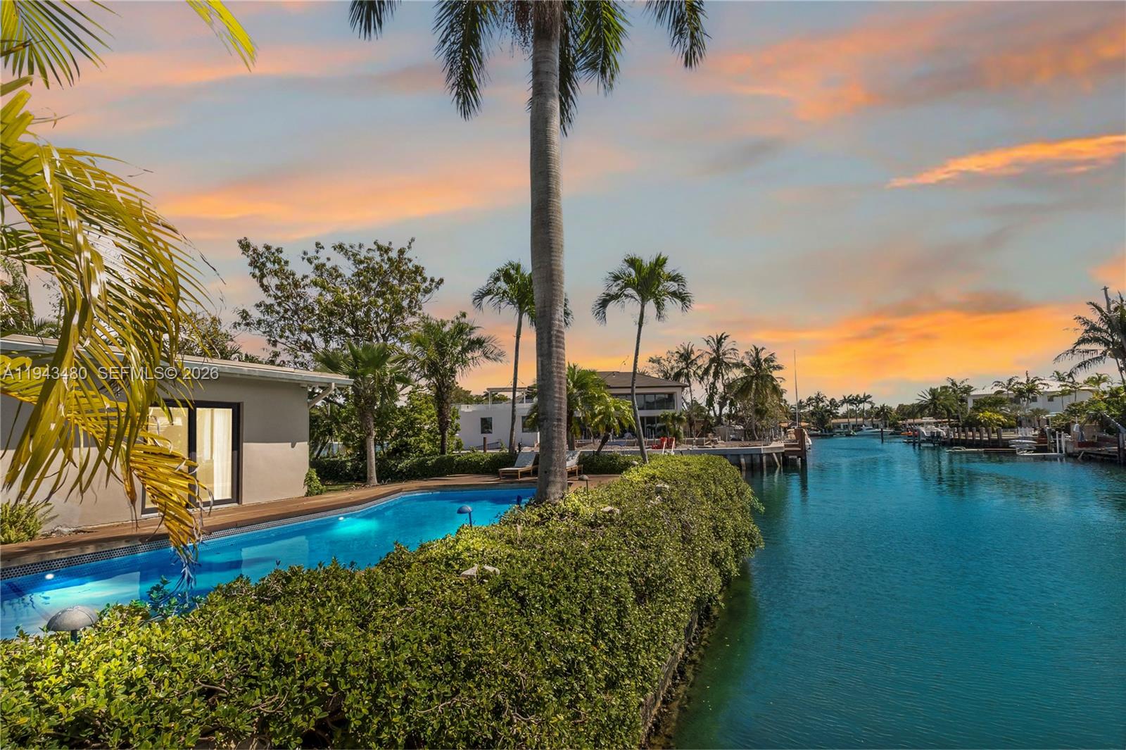 12901 Oleander Road North Miami, FL 33181 - Photo 5 of 30 a view of a house with pool and a yard