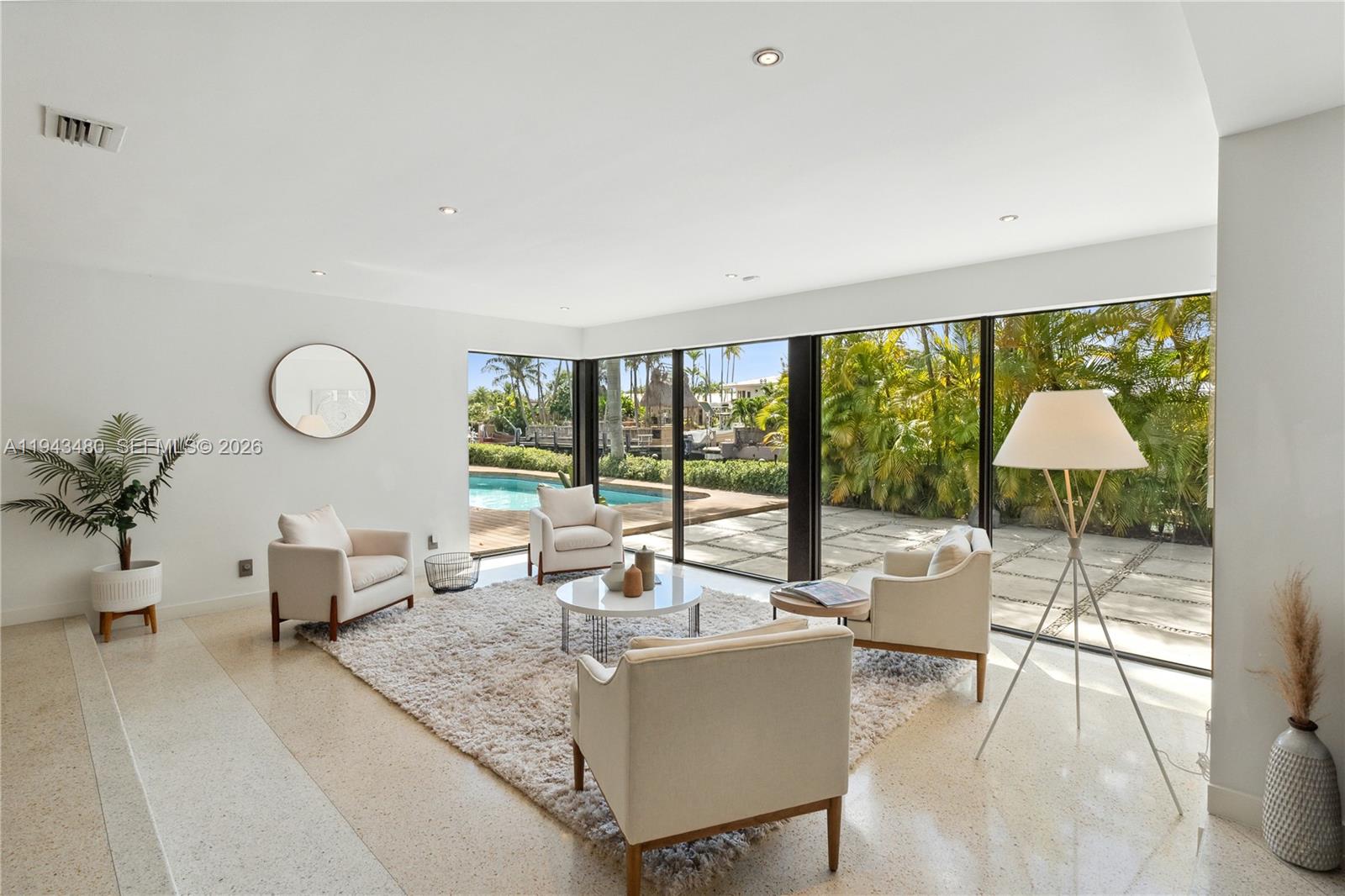 12901 Oleander Road North Miami, FL 33181 - Photo 10 of 30 a living room with furniture and a floor to ceiling window
