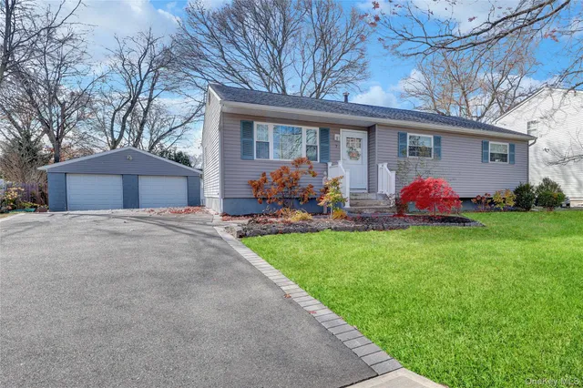 a front view of house with yard and green space