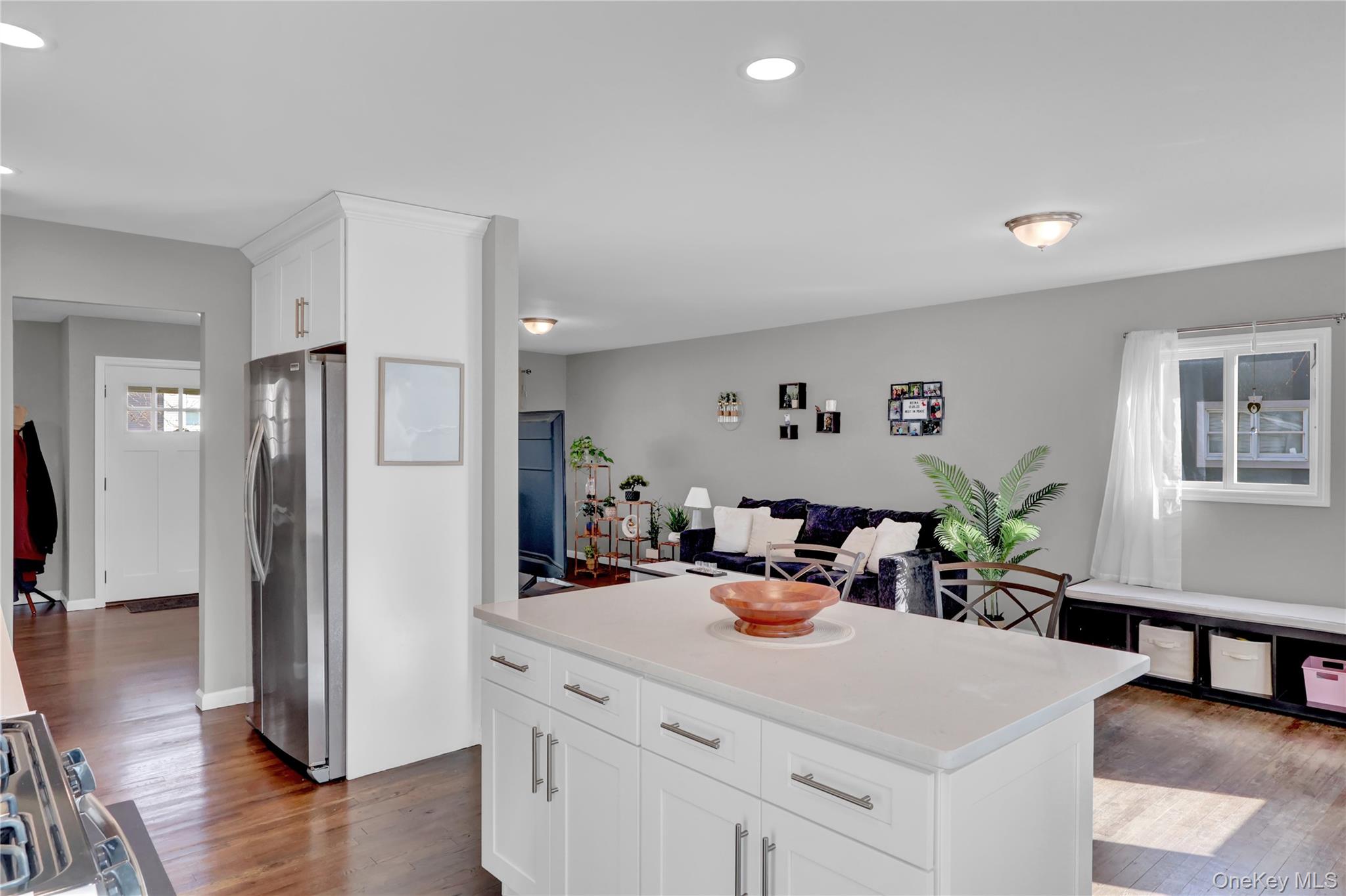7 Winston Road Centereach, NY 11720 - Photo 12 of 18 a view of a kitchen center island and living room view
