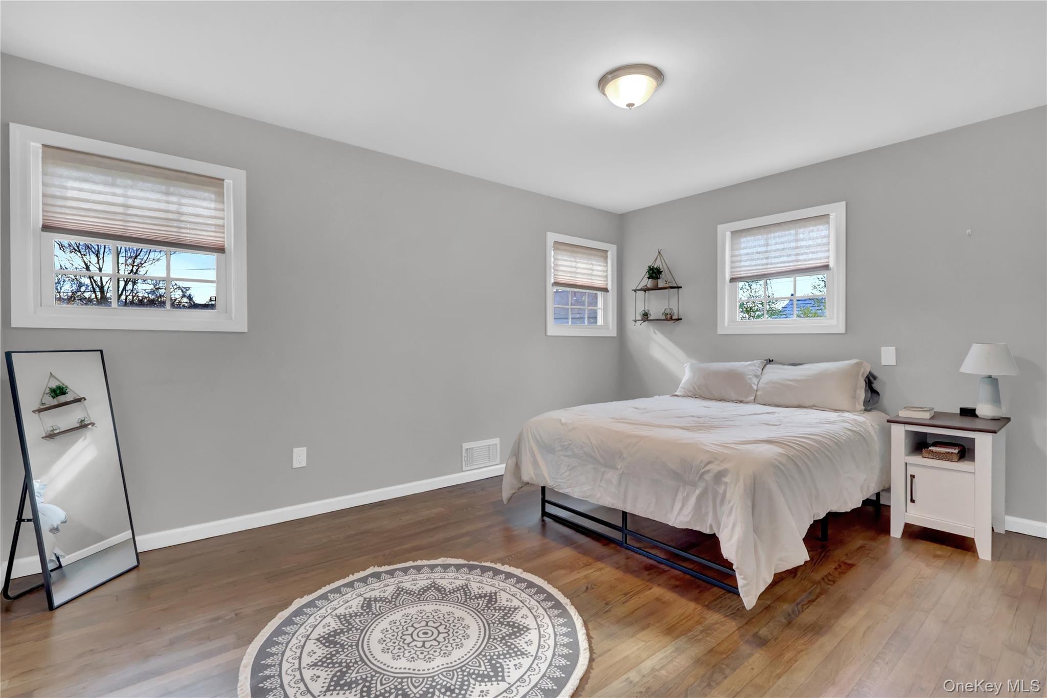 7 Winston Road Centereach, NY 11720 - Photo 13 of 18 a bedroom with a bed and a window