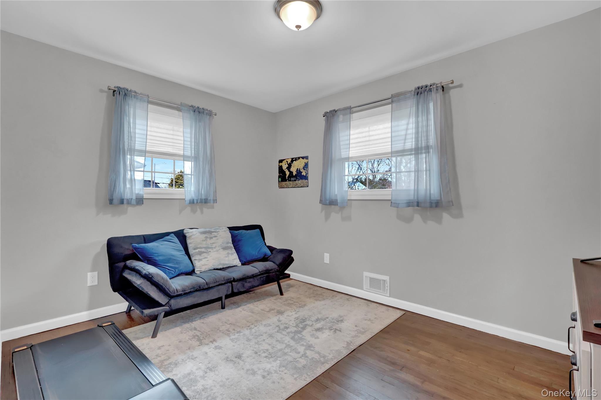 7 Winston Road Centereach, NY 11720 - Photo 15 of 18 a living room with furniture and a window