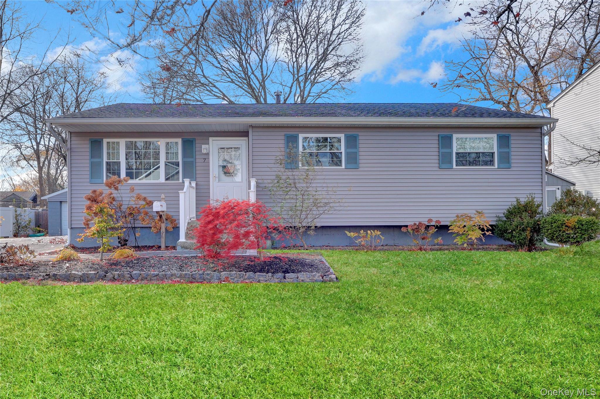 7 Winston Road Centereach, NY 11720 - Photo 3 of 18 a front view of house with yard and outdoor seating