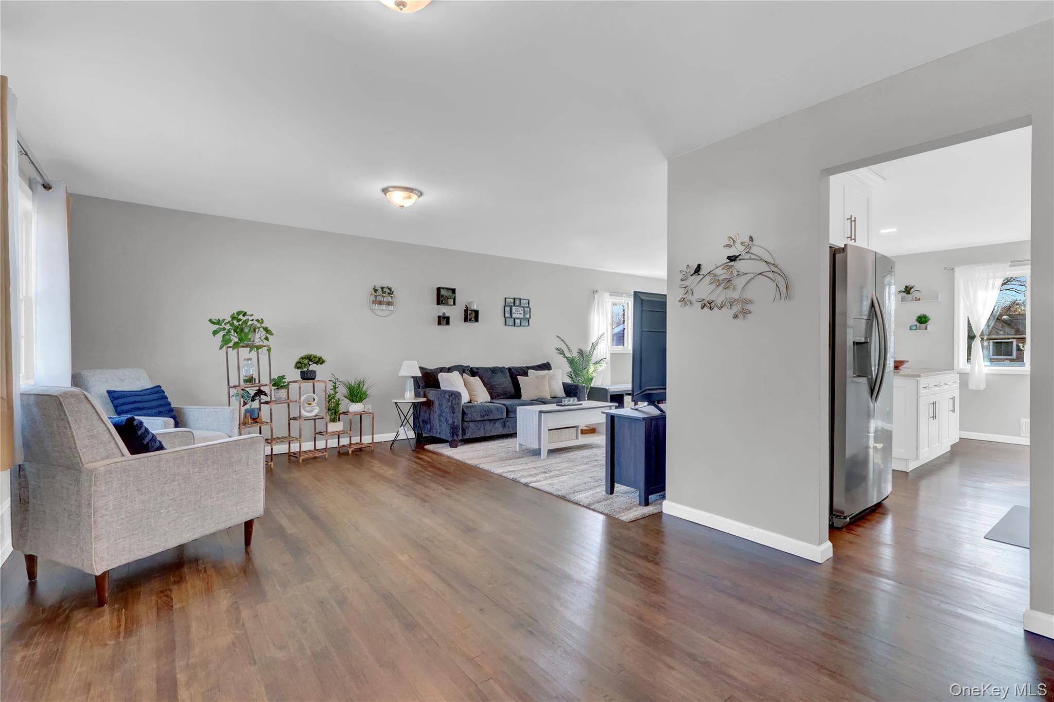 7 Winston Road Centereach, NY 11720 - Photo 6 of 18 a living room with furniture and a wooden floor