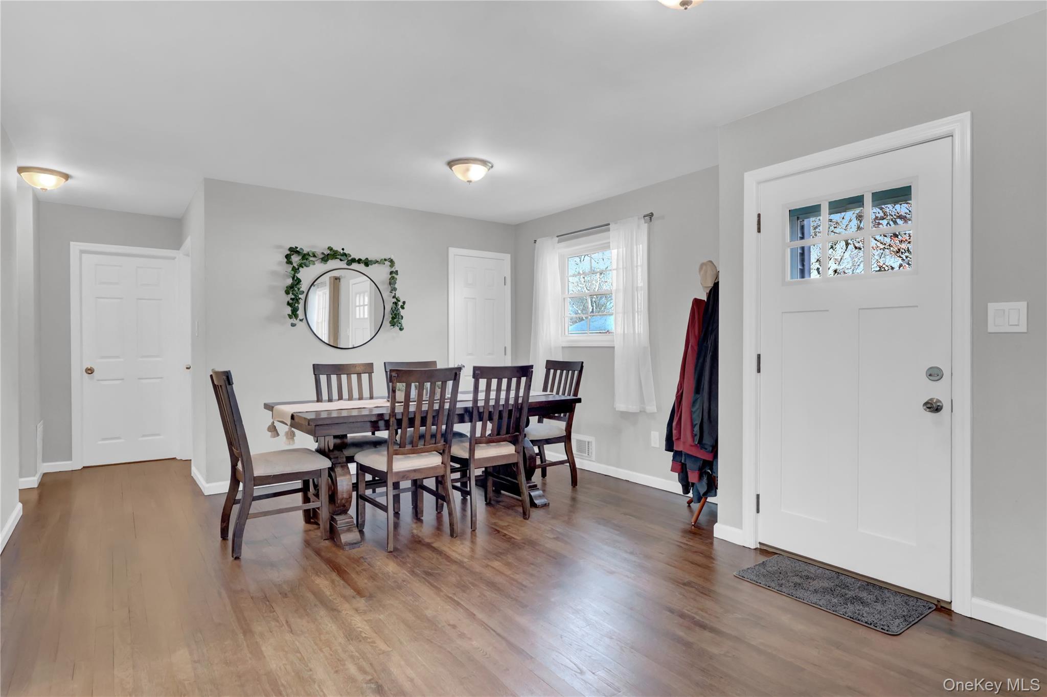 7 Winston Road Centereach, NY 11720 - Photo 7 of 18 a view of a dining room with furniture wooden floor and a window