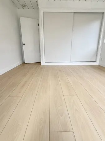 an empty room with a bench