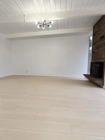 a view of a room with rack and a fireplace