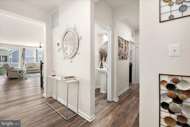 a kitchen with granite countertop a sink and refrigerator