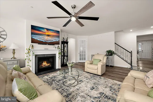 a spacious bedroom with a bed and a chandelier