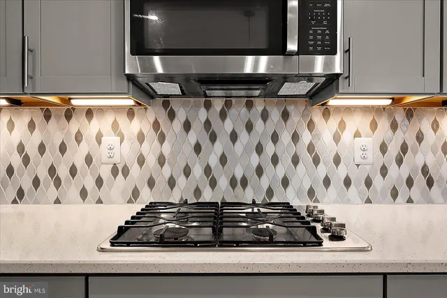 a bedroom with bed and a chandelier