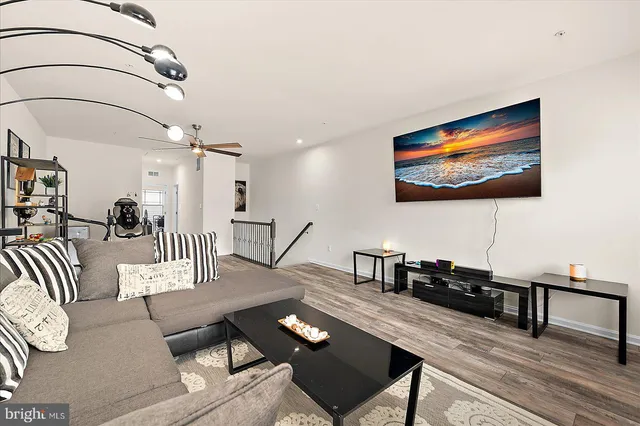 an aerial view of a house with swimming pool and lake view