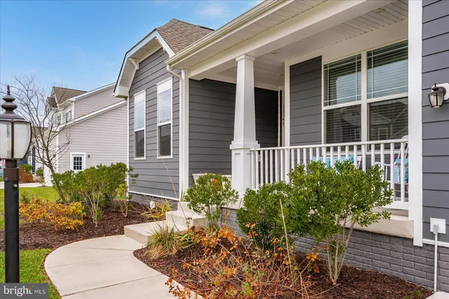 a view of a livingroom with furniture and a window