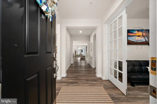 a view of living room with furniture and wooden floor