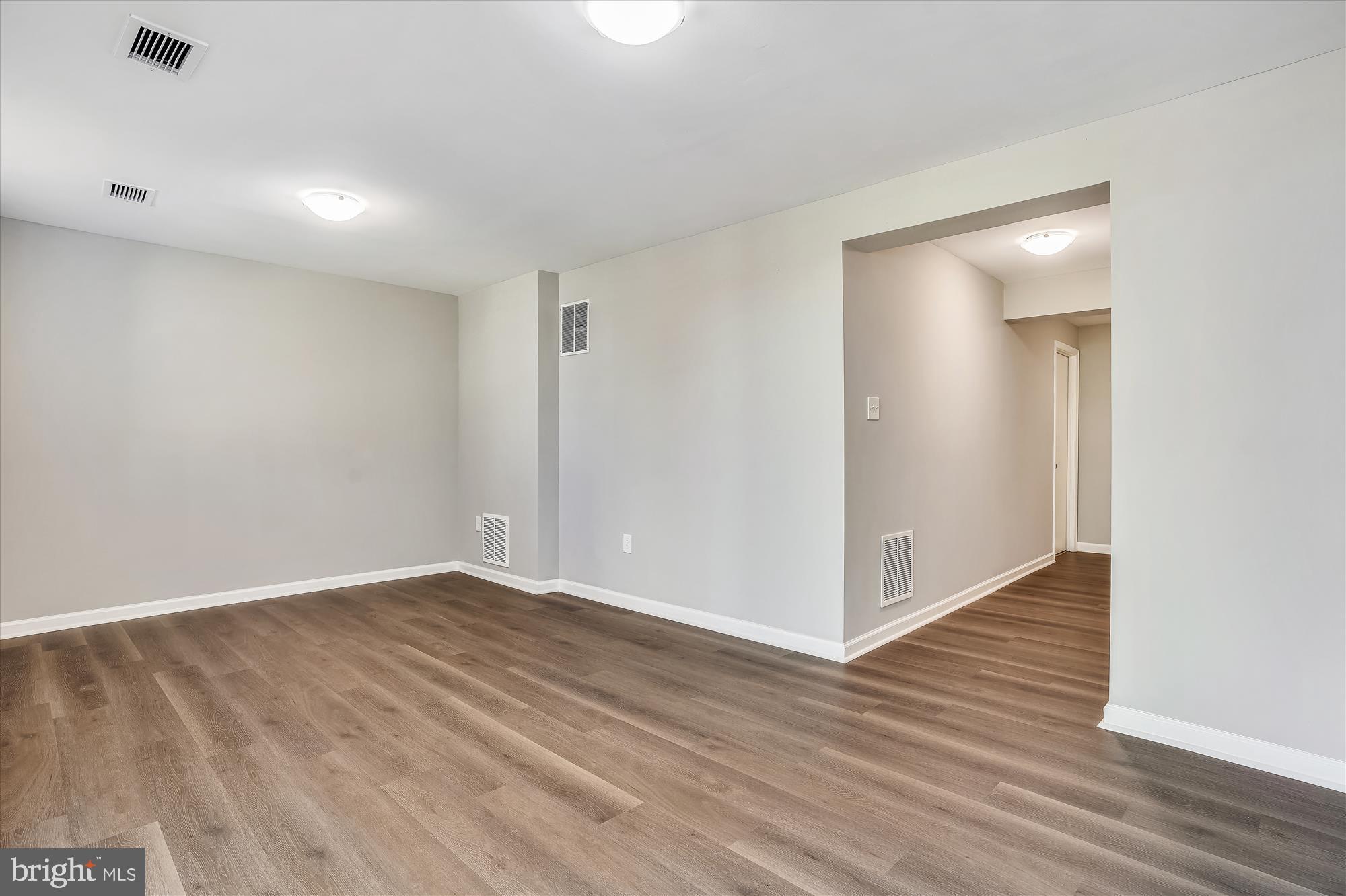 9202 Sprucewood Road Burke, VA 22015 - Photo 21 of 21 a view of an empty room with wooden floor