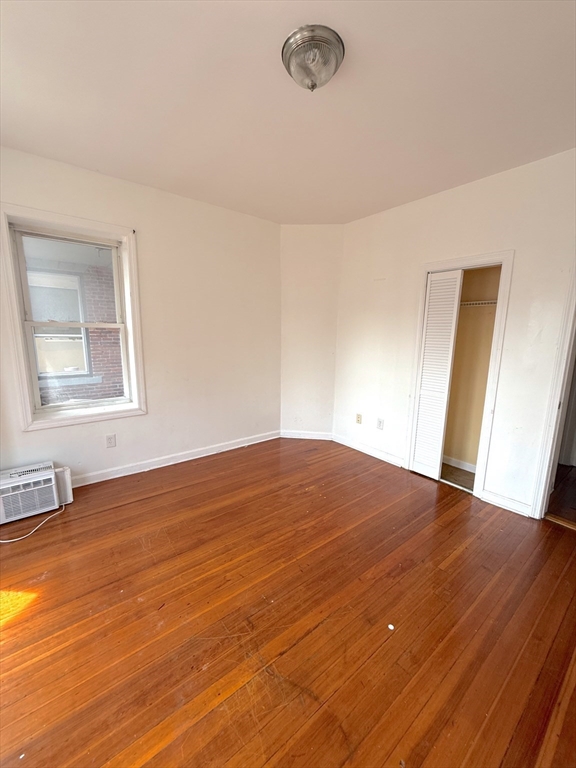 20 Huss Court, Unit 105 Lynn, MA 01905 - Photo 5 of 16 a view of empty room with wooden floor