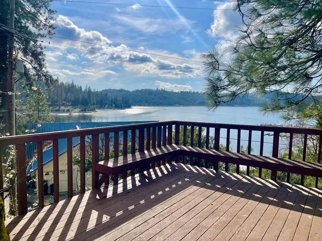 a view of wooden balcony with outdoor seating