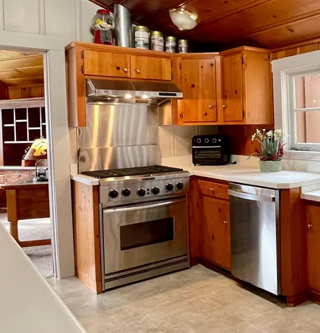 a kitchen with a stove and a sink