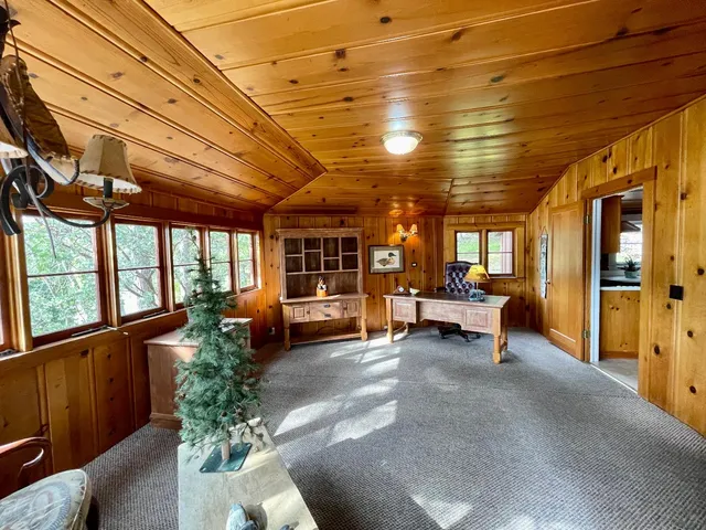 a view of living room with furniture and windows