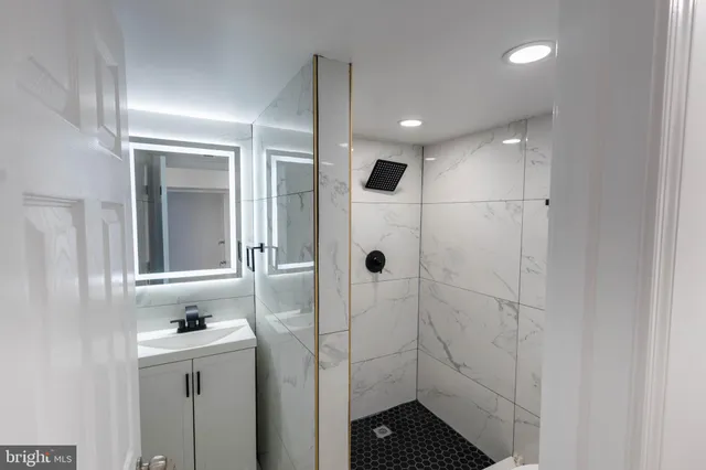 a bathroom with a sink and mirror