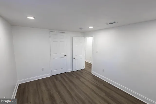 a view of room with wooden floor