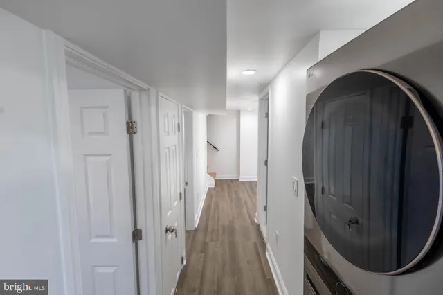 a view of a bathroom from a hallway