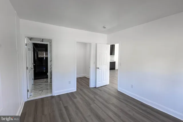 a view of a livingroom with wooden floor