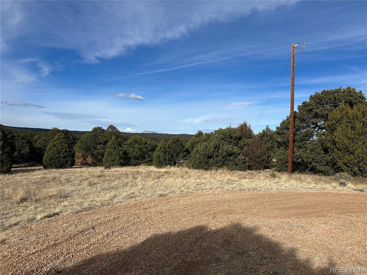 142 Silver Spur Road Walsenburg, CO 81089 - Photo 2 of 26 a view of a road with a snow on the road