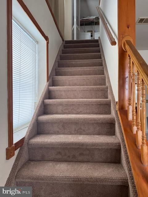 16 Archertown Road, Unit B New Egypt, NJ 08533 - Photo 15 of 19 a view of staircase with lots of frames on wall