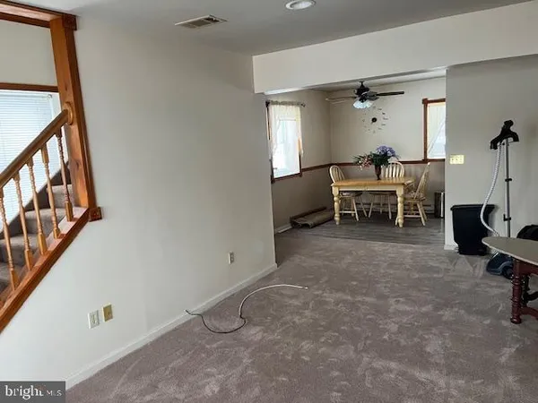 a view of a livingroom with furniture and a window