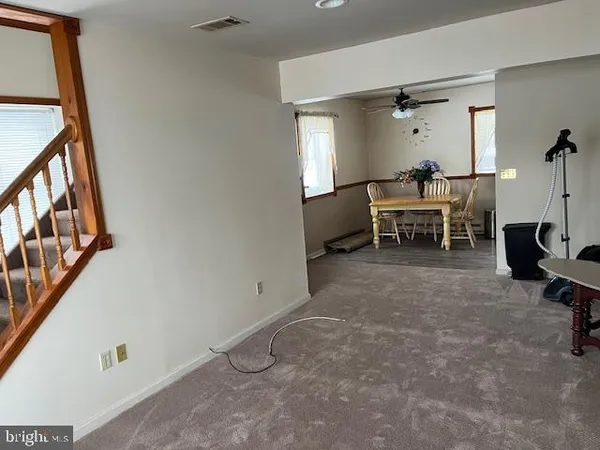 a view of a livingroom with furniture and a window