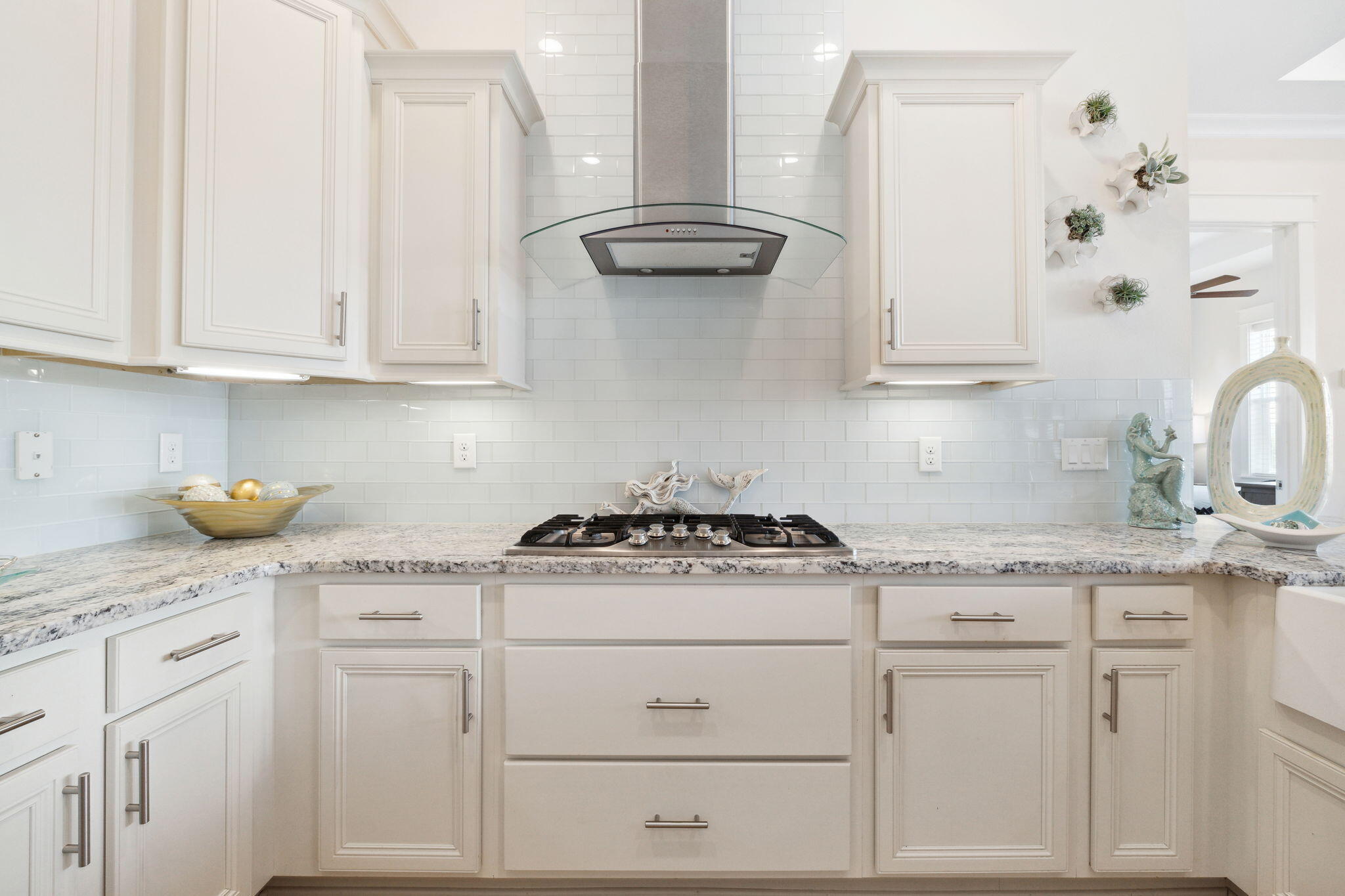 117 West W Pine, Unit C Inlet Beach, FL 32461 - Photo 12 of 45 a kitchen with granite countertop white cabinets and white appliances