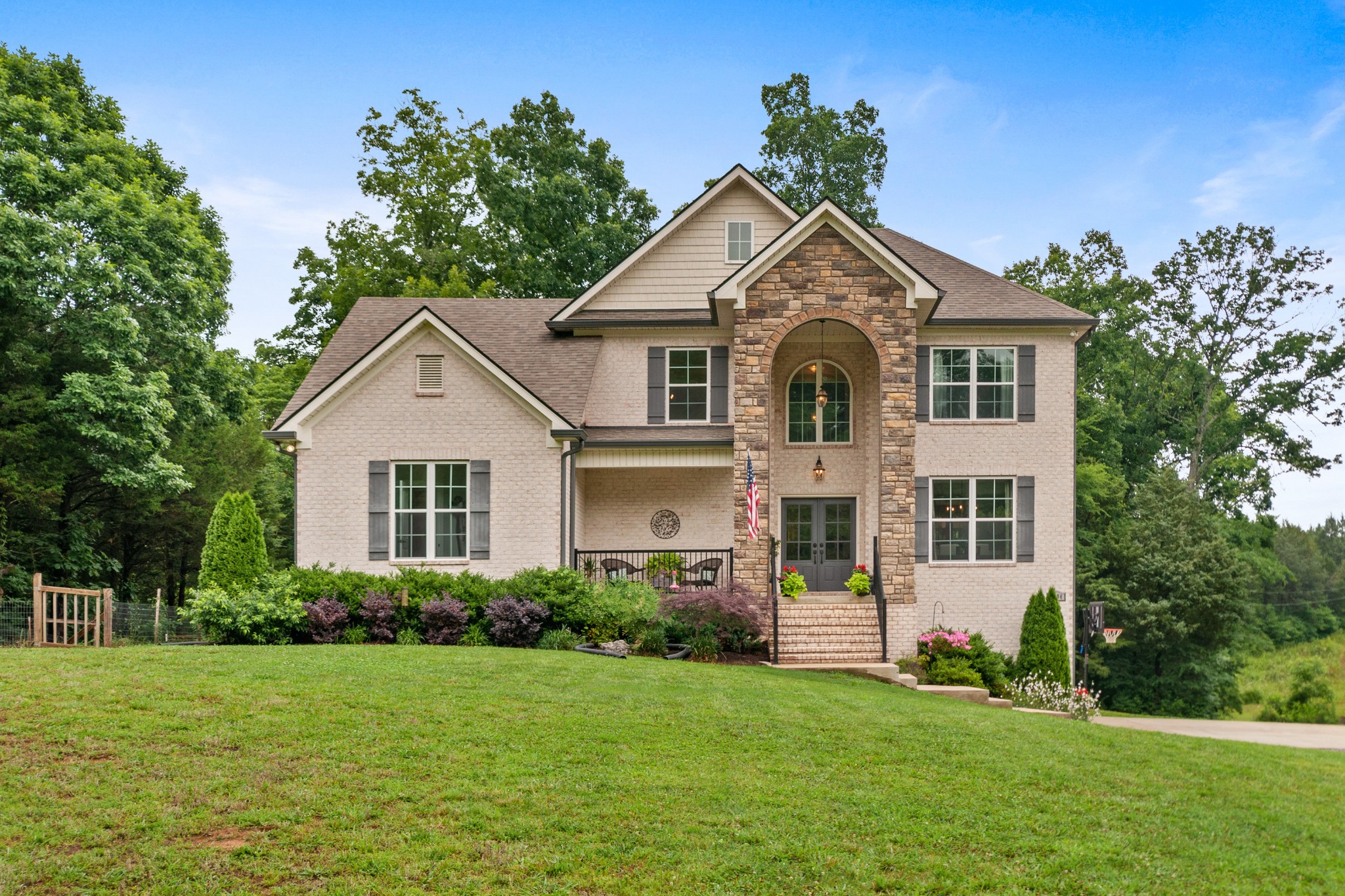 a front view of a house with a yard