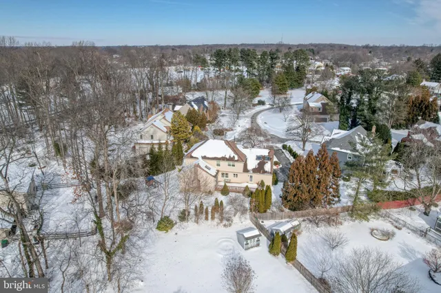 a view of a white house with a yard